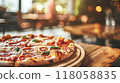 closeup pizza on wooden table in pizzeria restaurant background 118058835