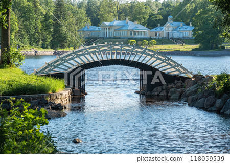 arched wooden pedestrian bridge in the park Monrepos in Vyborg 118059539