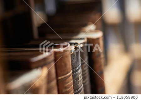 Old books in a library 118059900