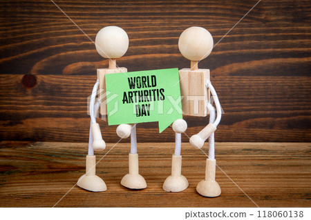 World Arthritis Day 12 October. Green speech bubble with text on wood texture background World Arthritis Day 12 October. Green speech bubble with text on wood texture background 118060138