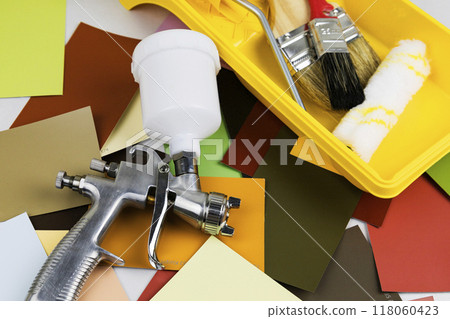 Paint spray gun at work at the workplace in the workshop. Paint Brush Paint spray gun at work at the workplace in the workshop. Paint Brush 118060423