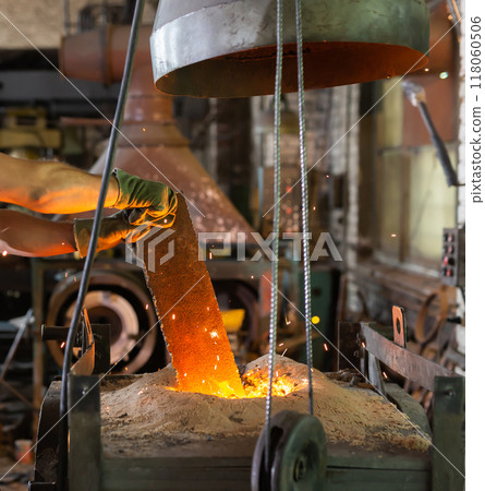 Ferrous metal billet is melted in an induction furnace closeup Ferrous metal billet is melted in an induction furnace closeup 118060506