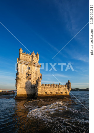 Belem Tower on the bank of the Tagus River on sunset. Lisbon, Portugal 118061315