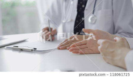 Doctor and a patient. Woman's hands gesturing during a consultation in the clinic. Medicine concept 118061725