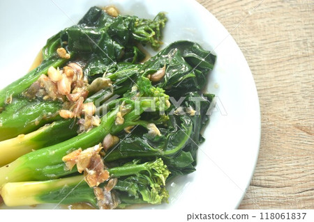 fried Kailaan Chinese kale dressing oyster sauce with chop garlic on plate 118061837