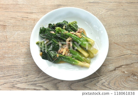 fried Kailaan Chinese kale dressing oyster sauce with chop garlic on plate fried Kailaan Chinese kale dressing oyster sauce with chop garlic on plate 118061838