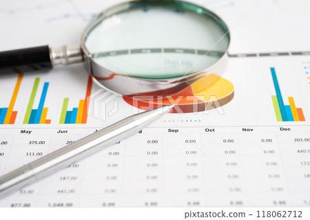 Magnifying glass on graph. Finance business and trading. 118062712