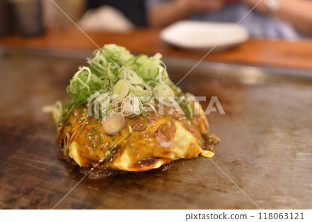 Okonomiyaki with a mountain of green onions Okonomiyaki with a mountain of green onions 118063121