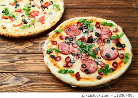 2 pizza with mozzarella cheese , salami sausages , olives , chicken , pineapple and tomatoes 2 pizza with mozzarella cheese , salami sausages , olives , chicken , pineapple and tomatoes 118064093