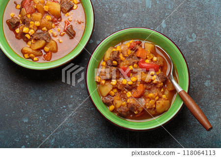 Two bowls of Carbonada Criolla, Argentinian beef casserole stew with beef, sweet potatoes and corn Two bowls of Carbonada Criolla, Argentinian beef casserole stew with beef, sweet potatoes and corn 118064113
