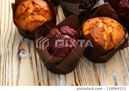Mix of muffins ( cupcake ) chocolate , vanilla , berries . Top view 118064131