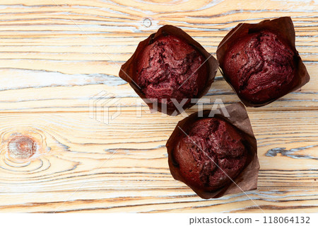 Sweet Baked berries muffins ( cupcake )  . Top view 118064132