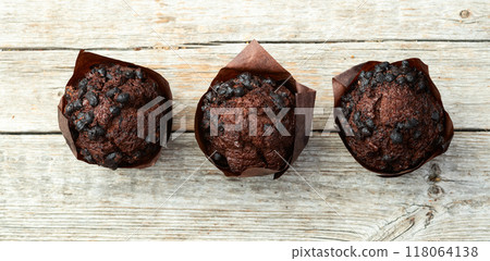 Sweet Baked chocolate muffins ( cupcake ) . Top view Sweet Baked chocolate muffins ( cupcake ) . Top view 118064138
