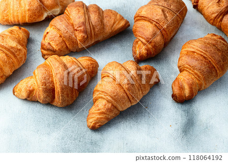 Group of sweet croissant . French morning breakfast . Top view Group of sweet croissant . French morning breakfast . Top view 118064192