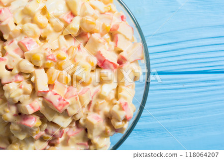 Traditional Russian New Year salad with crab sticks , corn , eggs and mayonnaise 118064207