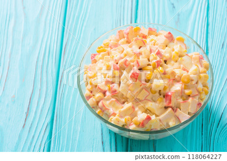 Traditional Russian New Year salad with crab sticks , corn , eggs and mayonnaise 118064227