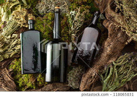 Vintage bottles with tinctures and various dried herbs. Vintage bottles with tinctures and various dried herbs. 118065831