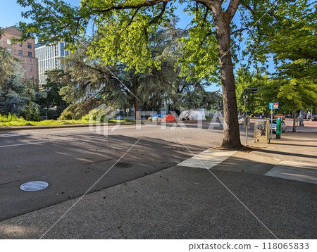PORTLAND, OREGON, USA - 05.13.2024: A homeless man's tent on a city street PORTLAND, OREGON, USA - 05.13.2024: A homeless man's tent on a city street 118065833
