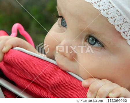 happy baby girl crawls and walks on the green lawn in the summer in the park. High quality photo happy baby girl crawls and walks on the green lawn in the summer in the park. High quality photo 118066060