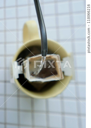 yellow cup freshly brewed coffee with convenient drip filter on table. prepare freshly brewed coffee yellow cup freshly brewed coffee with convenient drip filter on table. prepare freshly brewed coffee 118066216