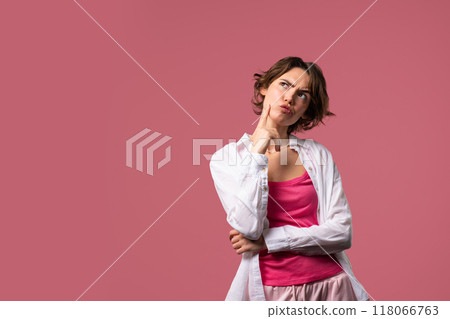 Thinking around stylish woman on pink background. Puzzled lady looking answer. Copy space. Thinking around stylish woman on pink background. Puzzled lady looking answer. Copy space. 118066763