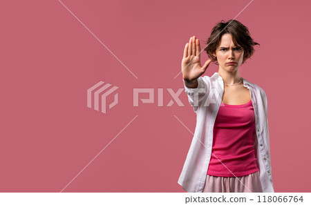 Uninterested woman disapproving with NO sign gesture. Denying, rejecting, enough Uninterested woman disapproving with NO sign gesture. Denying, rejecting, enough 118066764