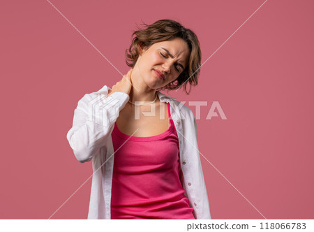 Tired Young Woman Feeling Pain In Neck Joint, Massaging Muscles, Rubbing Head Tired Young Woman Feeling Pain In Neck Joint, Massaging Muscles, Rubbing Head 118066783