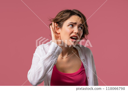 Curious woman doesn't hear, asking what. Quiet sound, deaf, misunderstand 118066798
