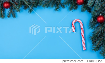 Christmas Background with Candy Cane, Fir Branches, and Ornaments Flat Lay with Copy Space Christmas Background with Candy Cane, Fir Branches, and Ornaments Flat Lay with Copy Space 118067354
