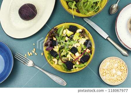 Fresh salad bowl with raw blackberries. 118067977