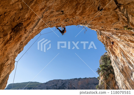 Man is climbing, training in the mountains. Man is climbing, training in the mountains. 118070581