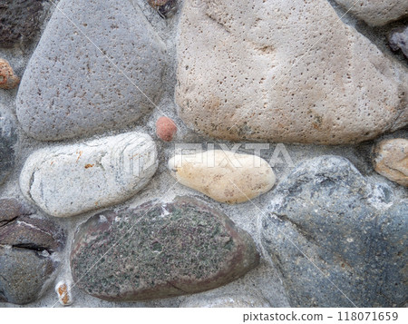 Background from cobblestones in cement. Interesting background. Unusual wall design. Sea city concept. 118071659