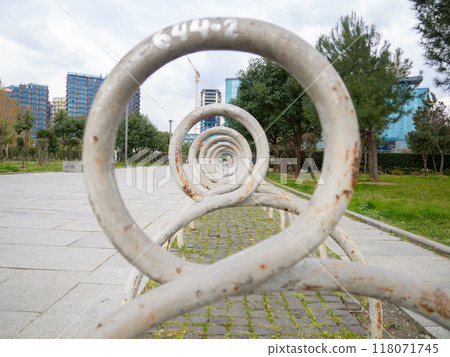Bicycle parking. infrastructure in the park. Place for bicycles. Empty. Unusual angle.  Round bicycle parking. 118071745
