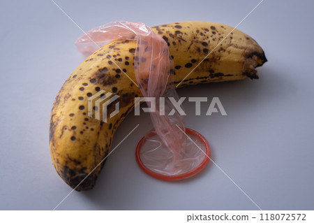 Condom and banana Condom and banana 118072572