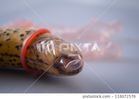 Condom and banana 118072576