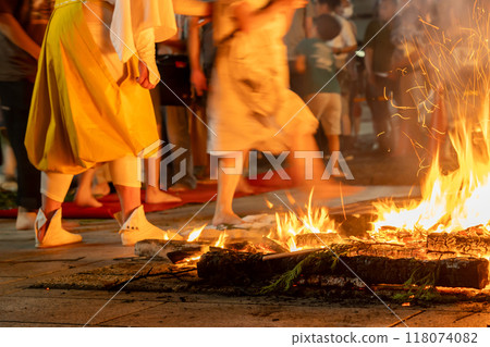 A monk guiding a fire walker at the Toka Kannon temple in Tsu City, Mie Prefecture A monk guiding a fire walker at the Toka Kannon temple in Tsu City, Mie Prefecture 118074082