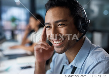 Im so glad we could help you. Shot of a young man using a headset in a modern office. 118074193