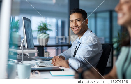 Your quality of work determines your worth. Shot of a young businessman using a computer in a modern office. 118074198