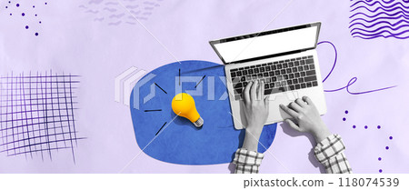 Person using a laptop computer and light bulbs Person using a laptop computer and light bulbs 118074539