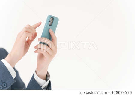 Hand of a man manipulating a smartphone 118074550