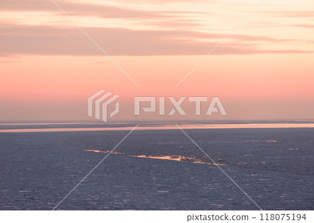 Shiretoko drift ice dyed by the setting sun 118075194