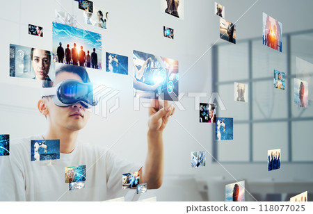 A man using VR goggles to control 3D images 118077025