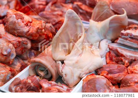 Variety meat in packing tray on glass window refrigerator of butcher shop. 118077981