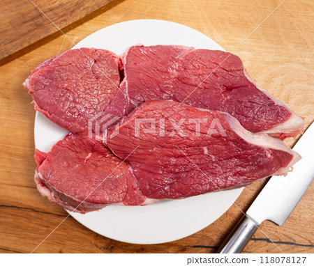 Pieces of raw thick beef steaks 118078127