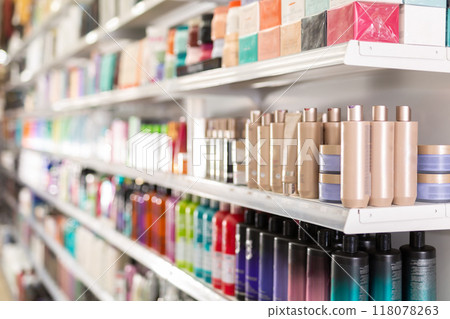Hair care products on store shelves in supermarket 118078263