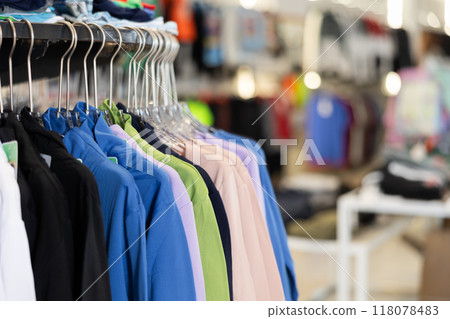 Sweatshirts hung on rack in clothing store Sweatshirts hung on rack in clothing store 118078483