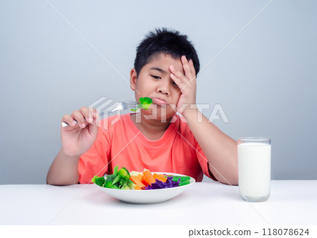 Children do not like to eat vegetables, Little cute boy refuses to eat healthy vegetables, Nutrition healthy eating habits for kids concept, Children do not like to eat vegetables. 118078624