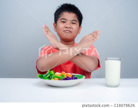 Children do not like to eat vegetables, Little cute boy refuses to eat healthy vegetables, Nutrition healthy eating habits for kids concept, Children do not like to eat vegetables. 118078626