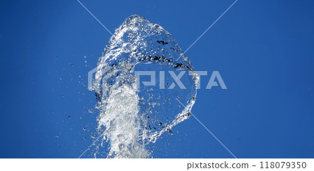 Background - Water in flight on a blue background takes on a variety of unique and bizarre shapes 118079350