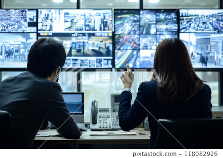 Security room_Security guard monitoring security camera footage_2 Security room_Security guard monitoring security camera footage_2 118082926